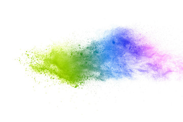 Freeze motion of colorful color powder exploding on white background.  Paint Holi.