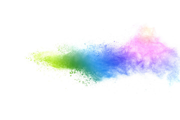 Freeze motion of colorful color powder exploding on white background.  Paint Holi.