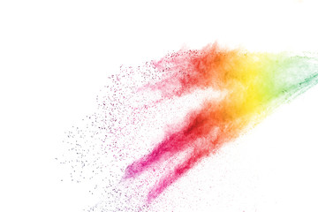 Freeze motion of colorful color powder exploding on white background.  Paint Holi.