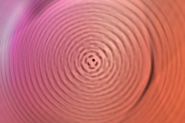 Abstract background of dot pattern spin radial motion blur.