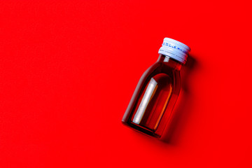 red syrup medicine contain in clear bottle and copy space for paste texture advertising pharmaceutical