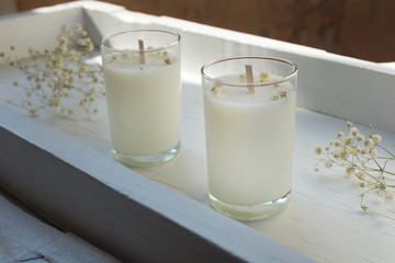 Сandle making - Handmade soy wax candle in glass on white background. Front view. Healthy lifestyle concept