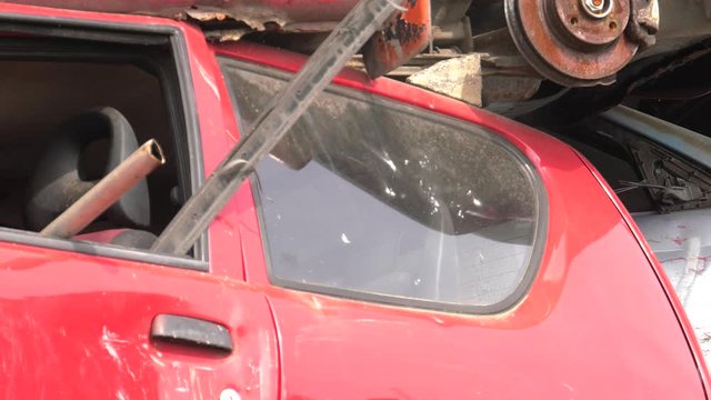 Someone breaks a window in the car.