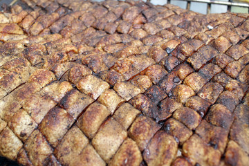 Roasted pork meat. Swine, pig, hog, sow on a barbeque. Grilled meat texture. Meat pattern. Skewer. African swine fever