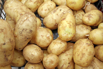 Potatoes. Young unpeeled spuds. Potatoes pattern.