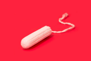 hygienic tampons on a red background, womens health