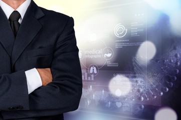 Confident business man wearing elegant suit with hands folded