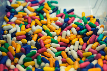Fototapeta na wymiar Sweet capsule colourful candies in box