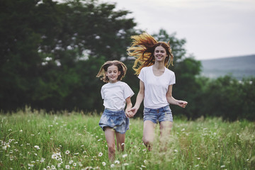 Fototapeta premium mother and daughter in the field