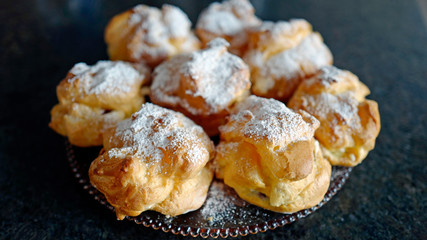 ready to eat on coffe time - cream puffs with powder sugar