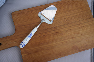 Vintage spoon on wooden butcher and fabric background