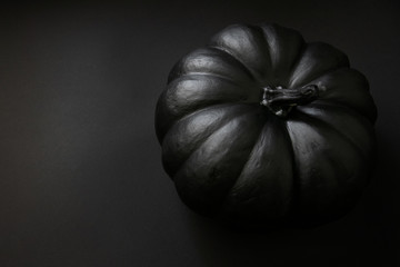halloween black pumpkin on the black background
