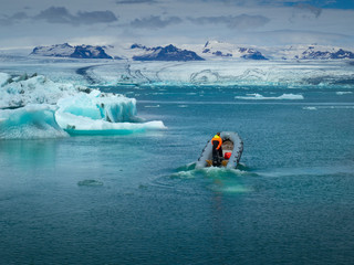 The man is sailing on a speedboat on Jökulsárlón lagoone