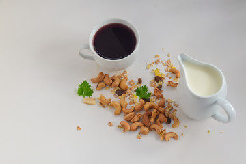 Coffee in white cup isolated on white background. Coffee break with snack ready to serve.
