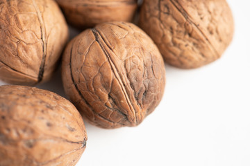 Close up walnuts on the white background.