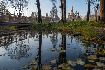 Zaryadye Park overlooking the Moscow Kremlin and St Basil's Cathedral, Russia. Zaryadye is a new tourist attraction of Moscow. Panoramic scenic view of the Moscow central park and garden in summer.