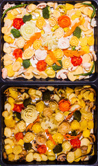 Fresh and baked craving vegetables and lard flower top view