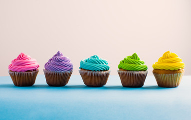 Vivid colous cupcake in a row, choice concept