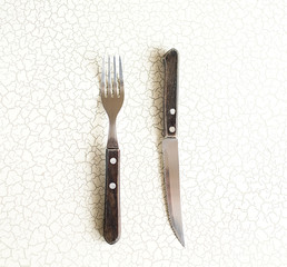 Cutlery. Composition of cutlery Two knife and fork on the table constitute a geometric shape triangle. The composition of the cutlery.