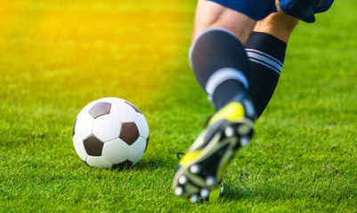 Running soccer player. Soccer football background.