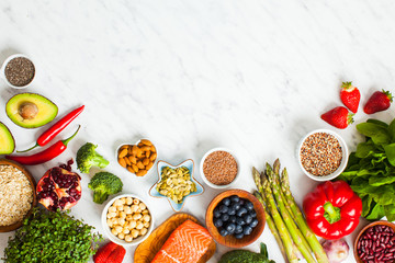 Top view of Superfoods on white marble background