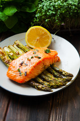 Salmon and asparagus with lemon and micro green