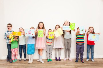 Obraz premium Kids with their handmaded decorations or greeting card