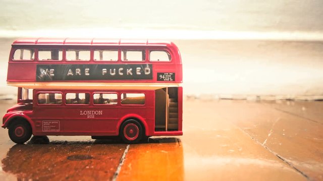 Brexit bus on a wooden floor stop motion film 