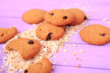 Oatmeal cookies with raisins on a wooden table.