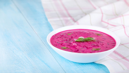 Vegetable cold soup with beetroots and natural yoghurt. Cold borscht - helpful for hot days. Ingredients cold soup: quail eggs, green onion, cucumber, dill, radishes, basil and natural yoghurt.