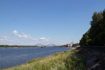 Naklejka premium Rybinsk. View of the building of the grain exchange, the Holy Transfiguration Cathedral and the bridge over the Volga river. View from the river