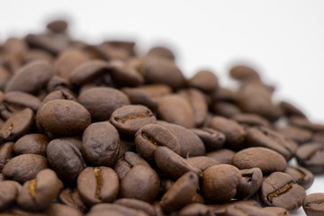 roasted coffee beans on white background