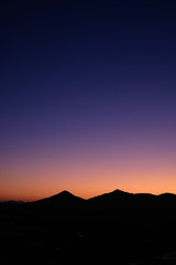 Sunset landscape over mountain silhouettes