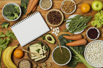 Top view arrangement with vegetables and notebook mock-up