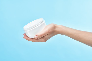 hand with bottle of water isolated on white