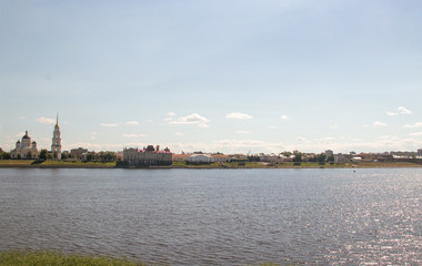 Rybinsk. View of the building of the grain exchange, the Holy Transfiguration Cathedral and the bridge over the Volga river. View from the river