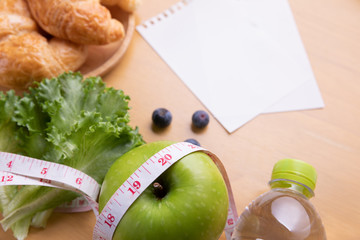 Diet plan, menu or program, tape measure, water and diet food, weight loss and detox concept.