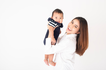 Happy newborn cute baby and beautiful mom in studio