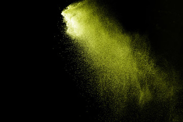 Pink powder explosion on black background. Paint Holi.