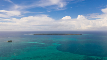 Beautiful seascape. Sea with lagoons and islands, blue sky with big clouds. Philippine nature.