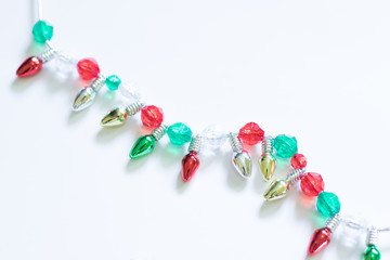 Christmas Tree Lights and Beads on a White Background