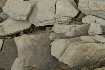 Gray coarse rock formations. monochrome design 