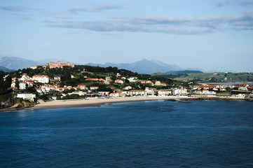 The village of Comillas and the mountain range of  'Picos de Europa' in Cantabria, north of Spain