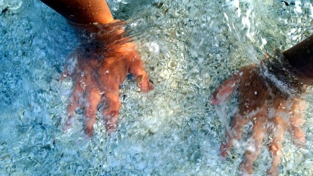 photos of my hands in the sea water