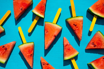 Fresh watermelon slices on the blue background. Summer fruit concept.