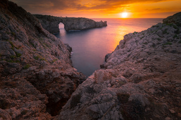 Famous Pont d'en Gil at the west coast of Menorca, Balearic Islands, Spain.