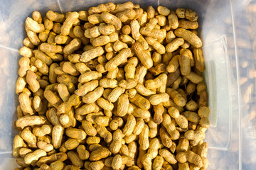 Peanut background food. peanuts in shell texture. Close-up of peanuts in shkarlupe view from above.