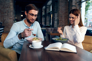 young couple having dinner in restaurant