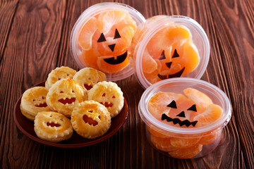 Halloween snacks - tangerine in boxes and pies © manyakotic