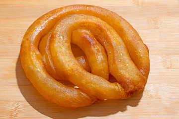 Jalebi an Indian sweet made by deep frying flour and dipping it in the sweet sugar syrup